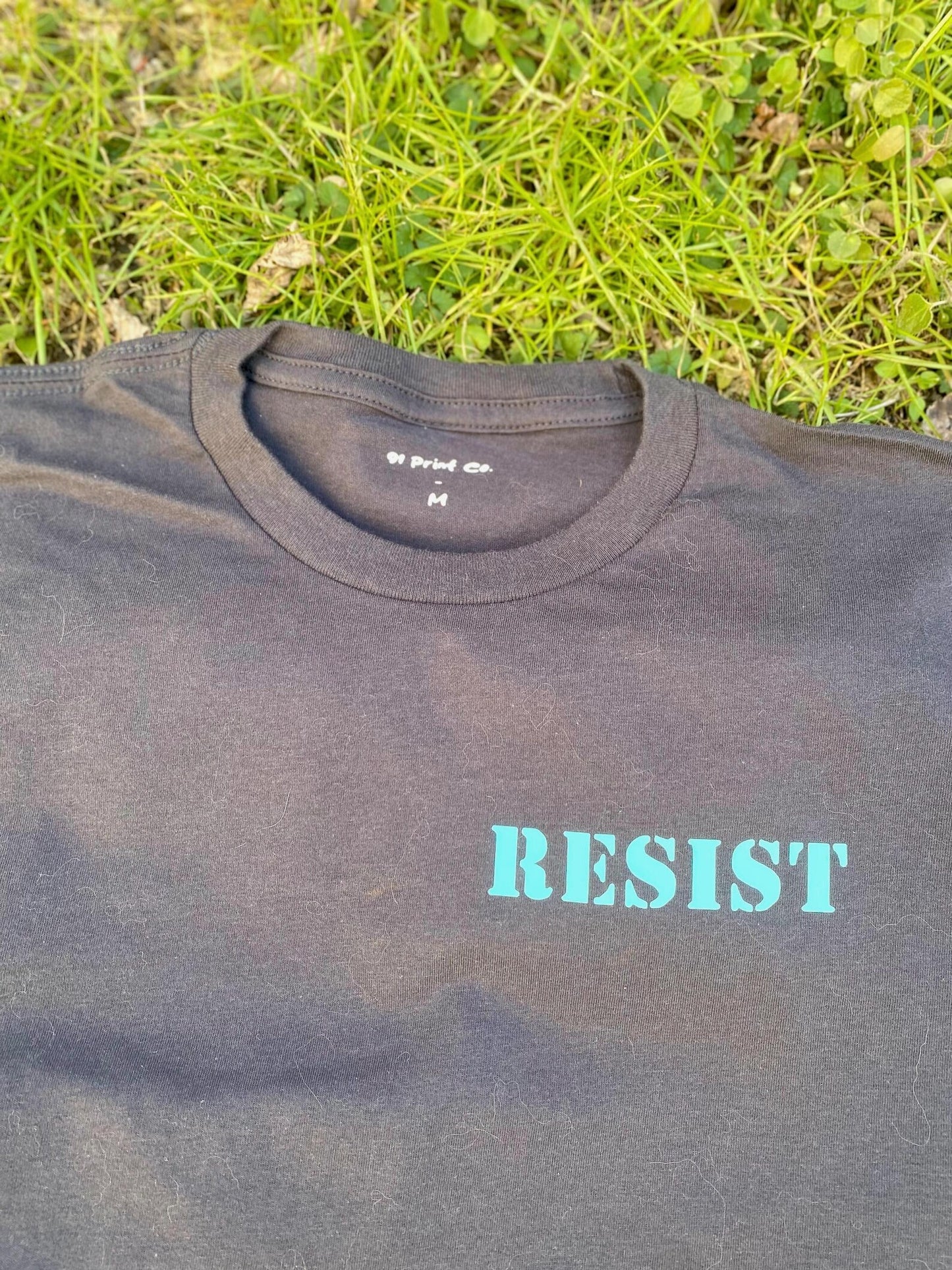 RESIST - Dark Gray Charcoal T-SHiRT with Teal Pocket Print on Left Chest