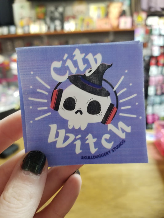 City Witch STICKER by Skullduggery Studio