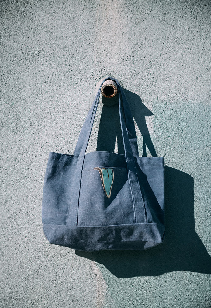 Reality is a Rumor Clock TOTE BAG by Bombardment