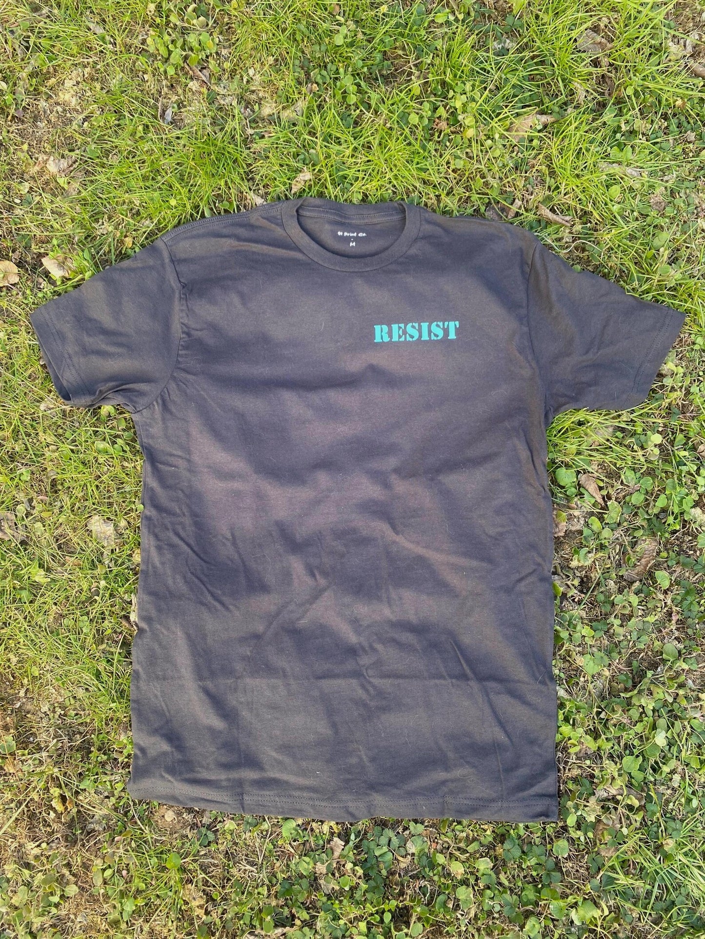 RESIST - Dark Gray Charcoal T-SHiRT with Teal Pocket Print on Left Chest